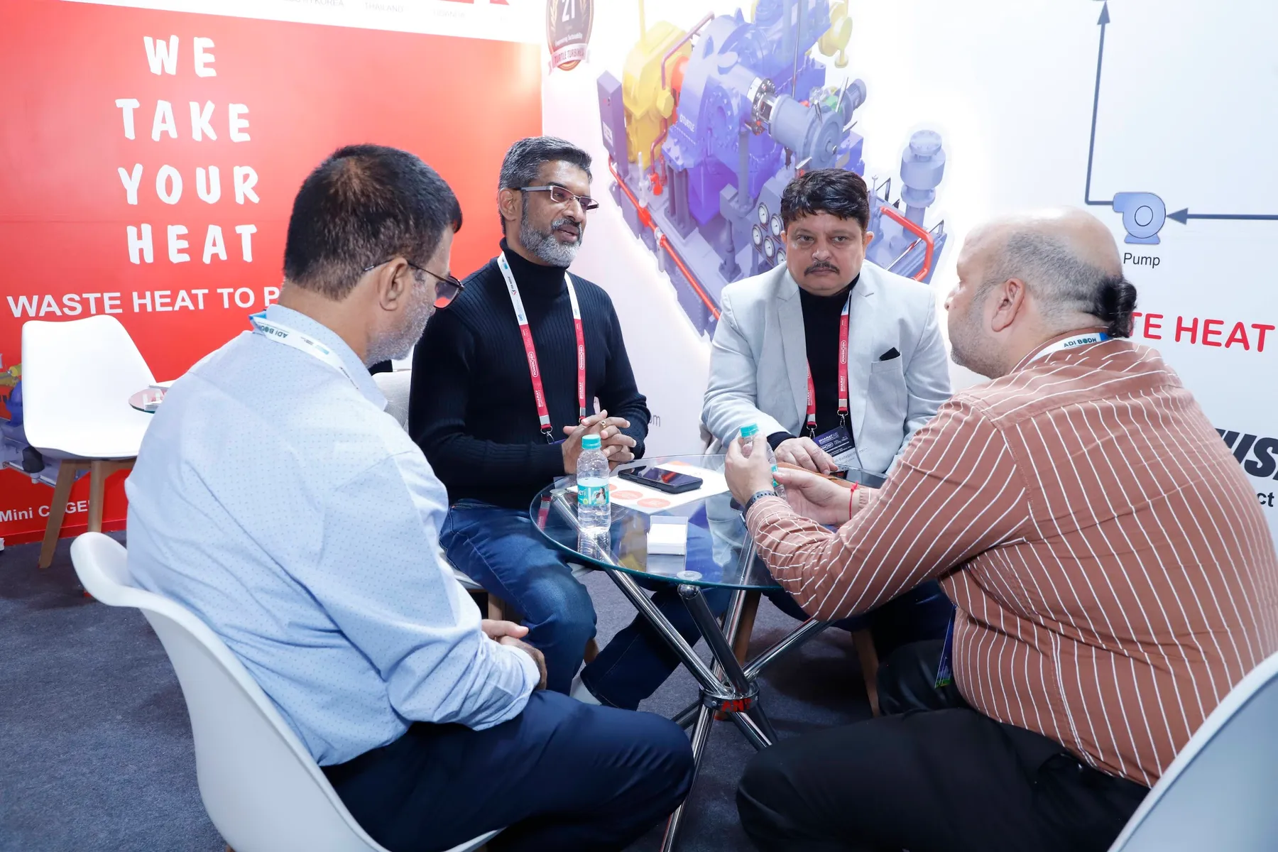 Participants discussing energy technology at the 2025 exhibition