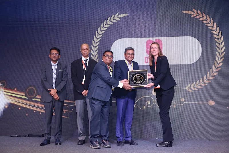 Participants holding an award during the ceremony
