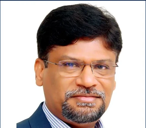 Dr. Kalirajan S. in the original 2025 speaker artwork