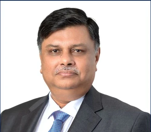 Shri Ravindra Kumar in the original 2025 speaker artwork