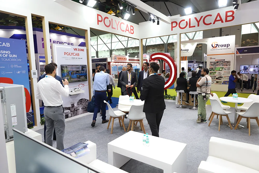 Exhibitors and visitors at an energy technology stand