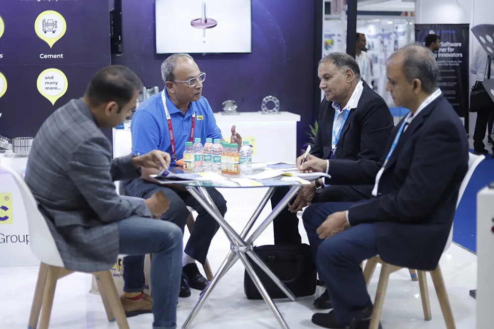Energy industry representatives meeting on the exhibition floor